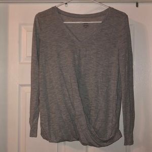 Long sleeve grey shirt with over lap on bottom